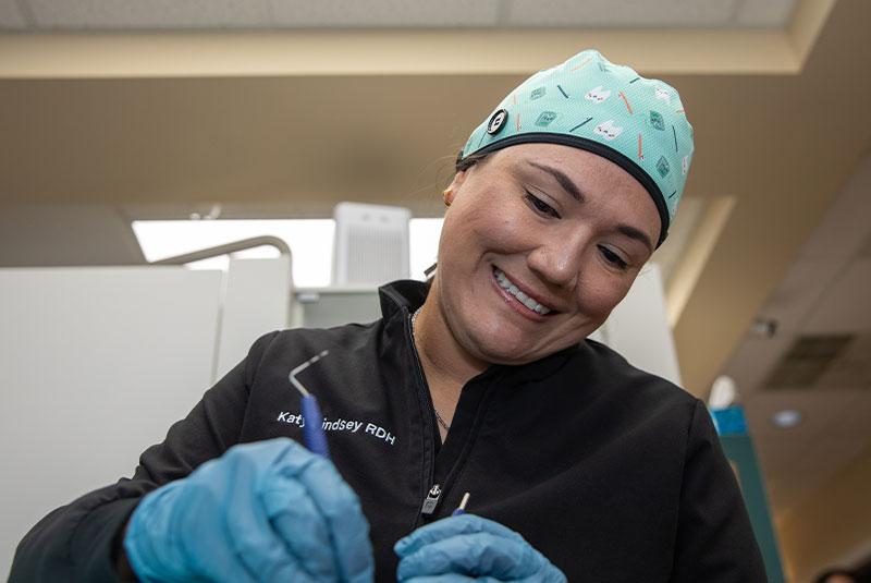 Team member doing a check up on Patients teeth