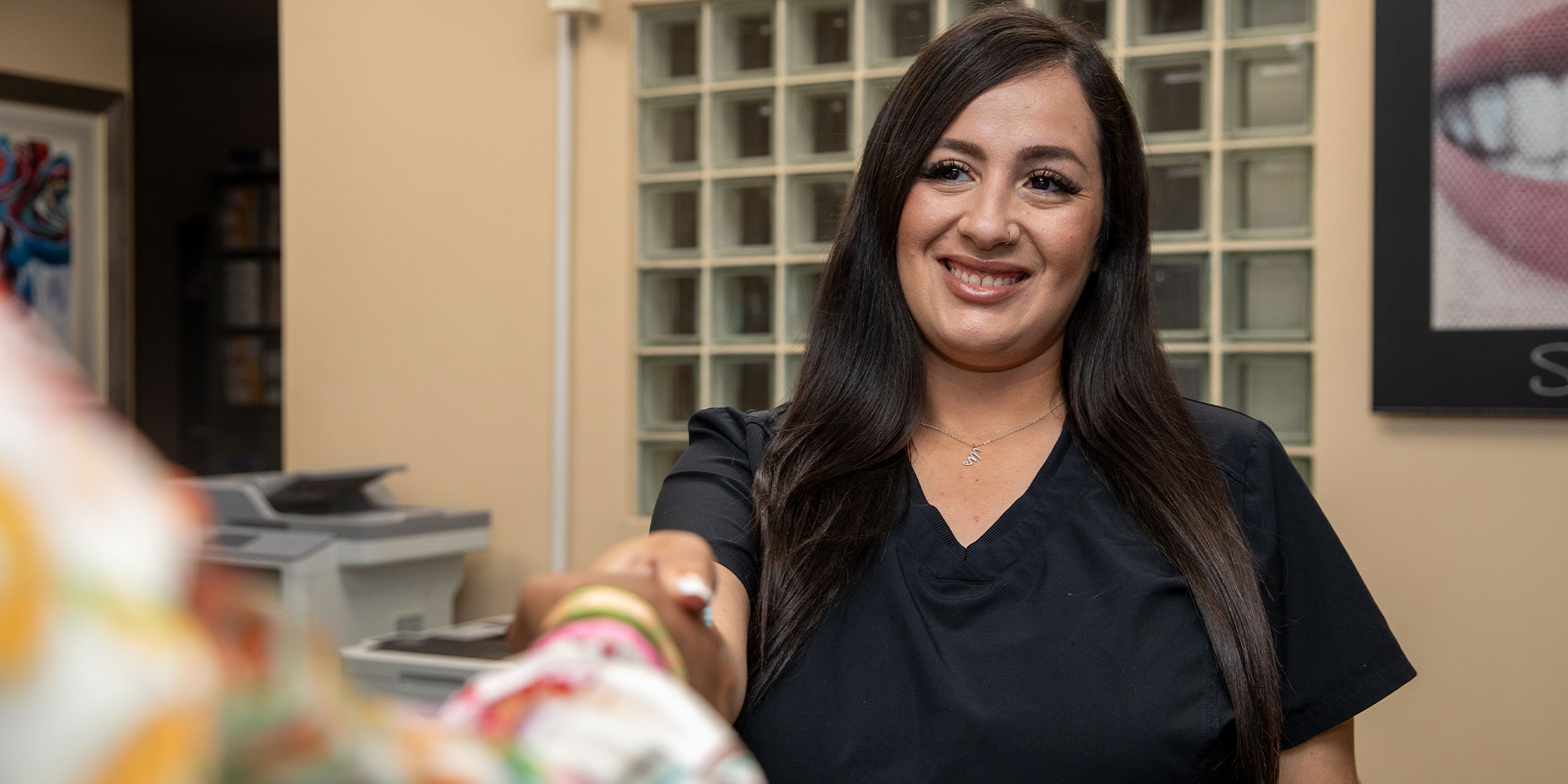 Team member checking Patient into office