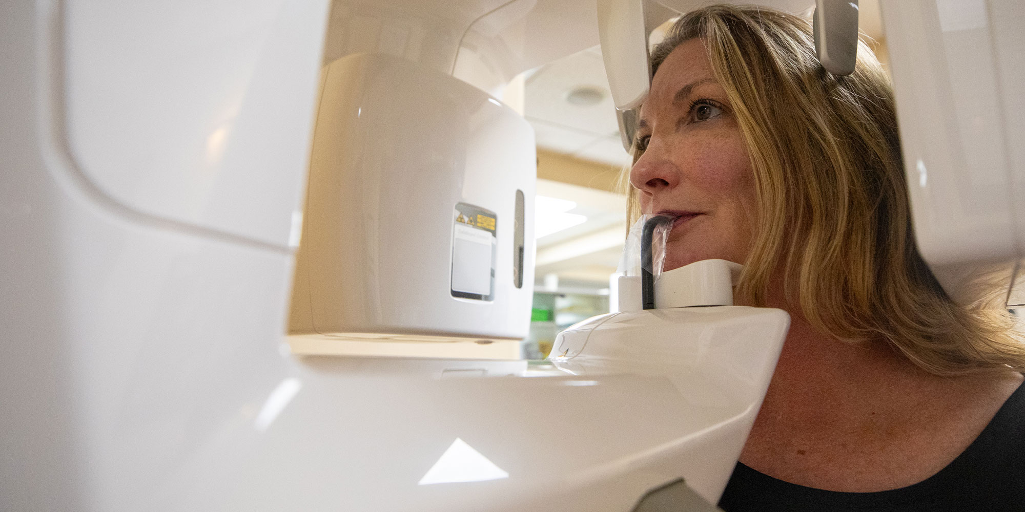 Patient taking a dental X-ray