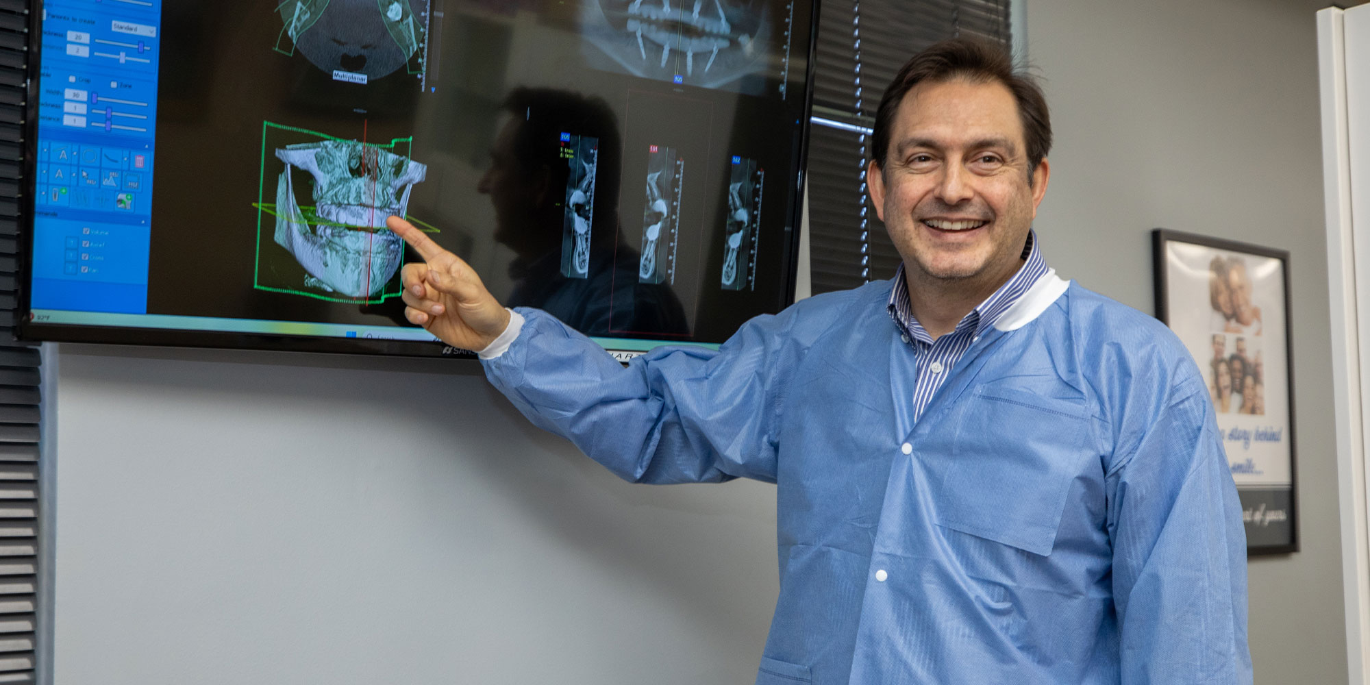 doctor going over dental procedure information with patient within the dental center