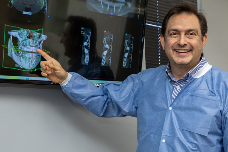 doctor going over dental treatment information with patient